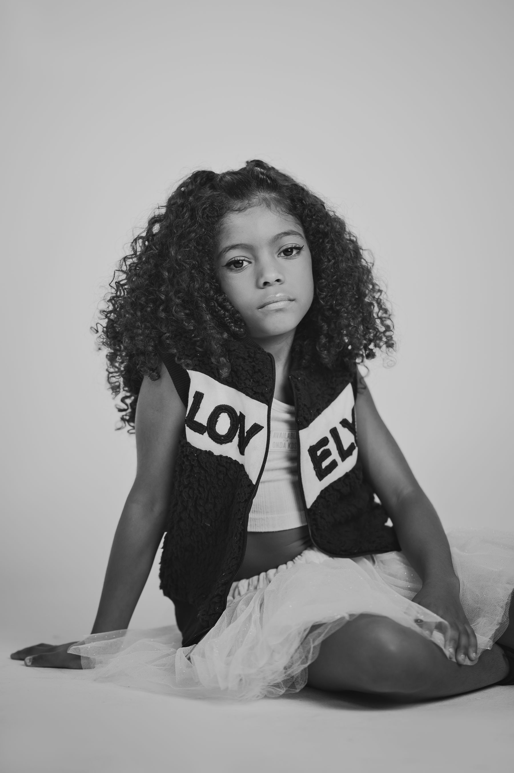 Black and white editorial portrait of a young model