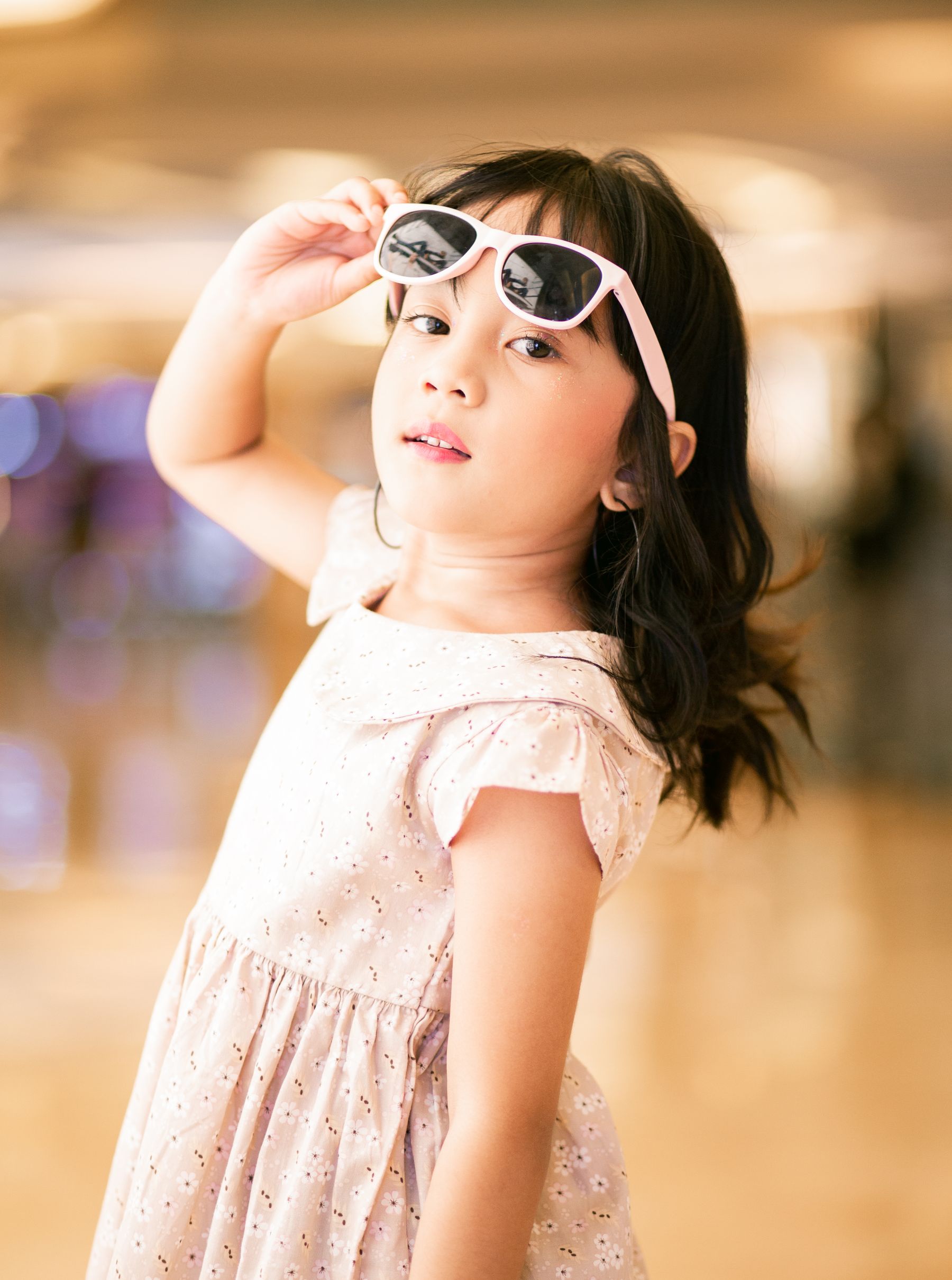Young model in white with statement sunglasses