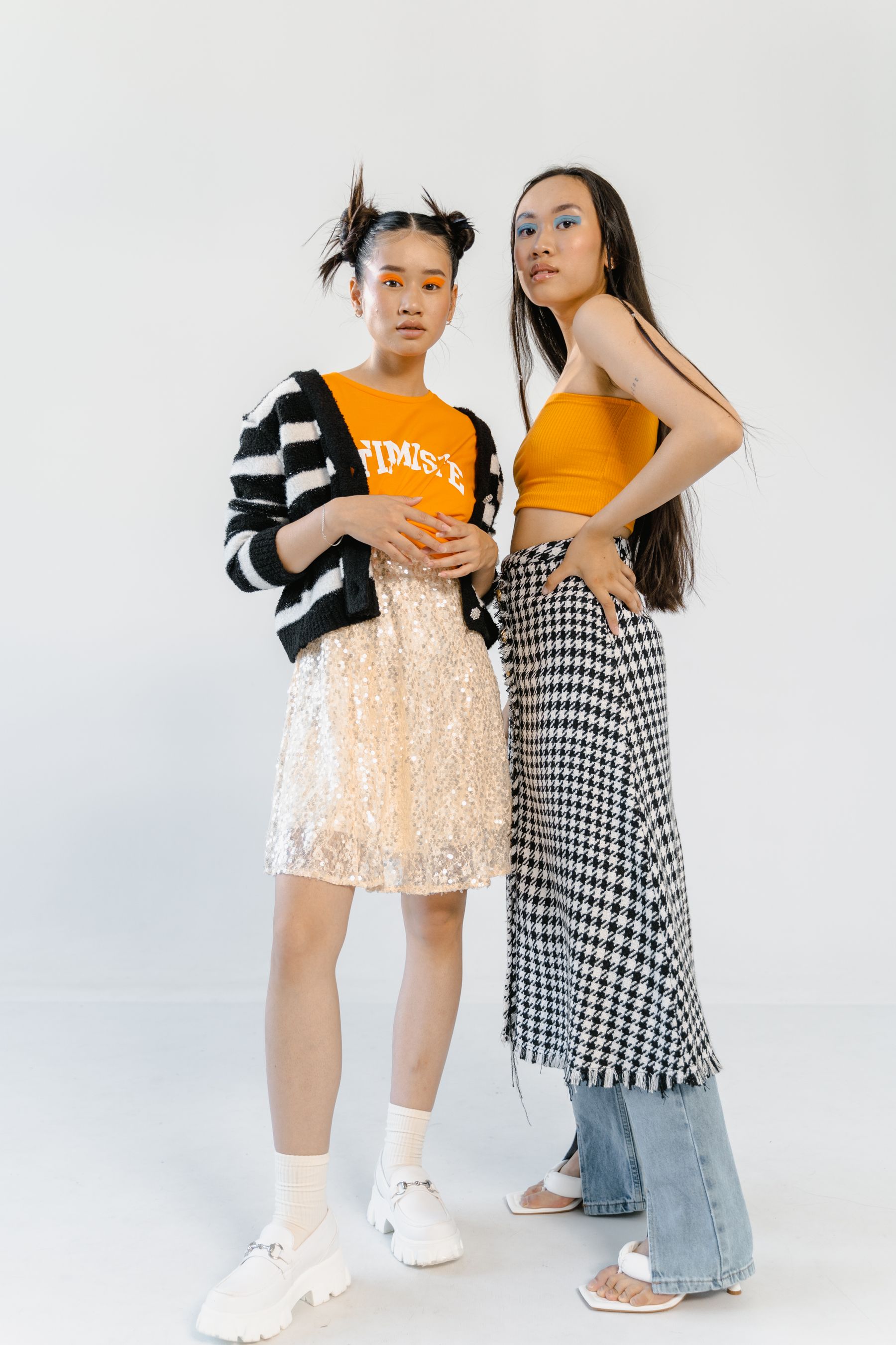 Teen models posing in a bright editorial studio shoot